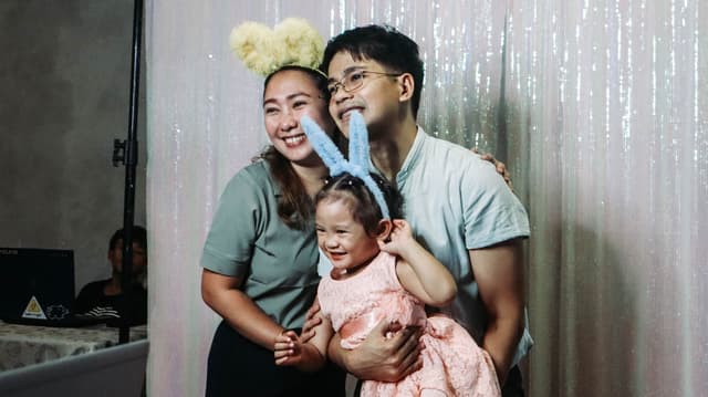 A family with their little girl
