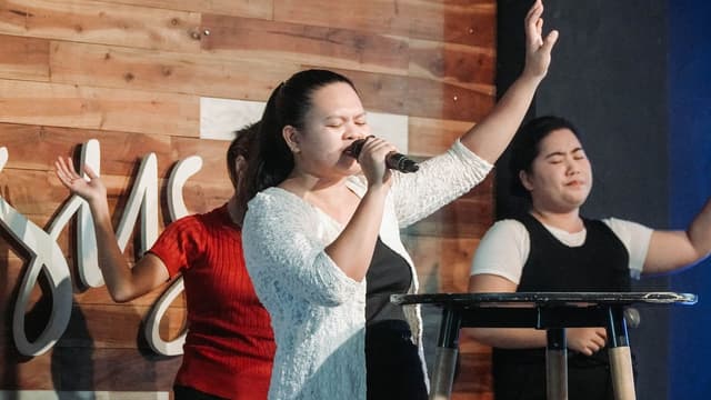 Women of MCOF worshipping during a Sunday service