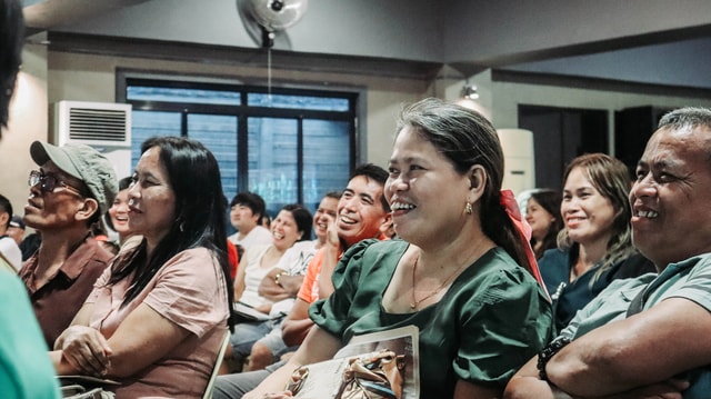 Members smiling during a teaching seminar at MCOF