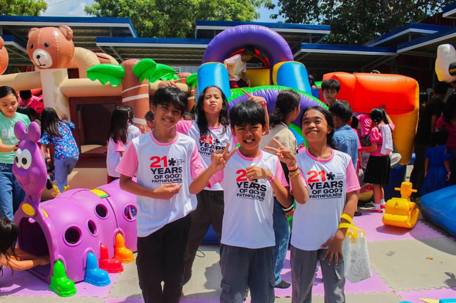 Kids smiling at the MCOF Kids play area